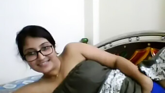 Julie, A Stunning Indian Housewife, Indulges In Solo Pleasure By Fondling Her Breasts